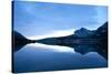 Glacier, Montana: Many Glacier Lodge Reflects Off of Swifcurrent Lake During Sunrise-Brad Beck-Stretched Canvas
