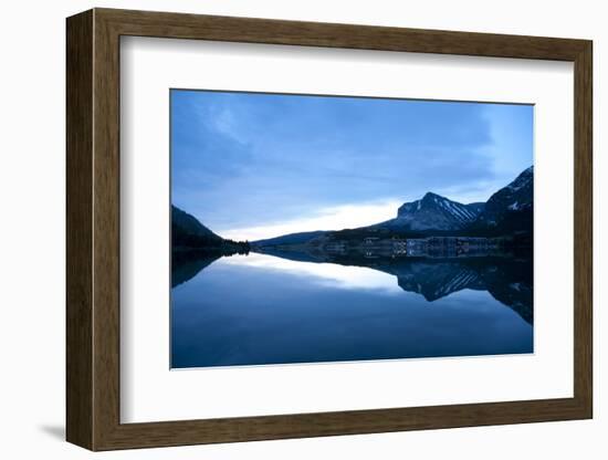 Glacier, Montana: Many Glacier Lodge Reflects Off of Swifcurrent Lake During Sunrise-Brad Beck-Framed Photographic Print