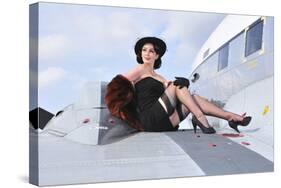 Glamorous Woman in 1940's Style Attire Sitting on a Vintage Aircraft-null-Stretched Canvas