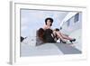 Glamorous Woman in 1940's Style Attire Sitting on a Vintage Aircraft-null-Framed Photographic Print