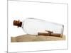 Glass Bottle With Note On Sand-null-Mounted Art Print