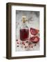 Glass Bottle with Pomegranate Juice and Pomegranate-Jana Ihle-Framed Photographic Print