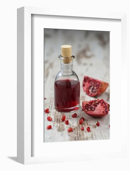 Glass Bottle with Pomegranate Juice and Pomegranate-Jana Ihle-Framed Photographic Print