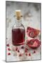 Glass Bottle with Pomegranate Juice and Pomegranate-Jana Ihle-Mounted Photographic Print