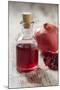 Glass Bottle with Pomegranate Juice and Pomegranate-Jana Ihle-Mounted Photographic Print