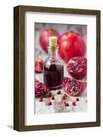 Glass Bottle with Pomegranate Juice and Pomegranates-Jana Ihle-Framed Photographic Print
