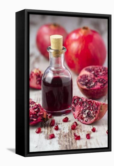 Glass Bottle with Pomegranate Juice and Pomegranates-Jana Ihle-Framed Stretched Canvas