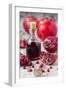 Glass Bottle with Pomegranate Juice and Pomegranates-Jana Ihle-Framed Photographic Print