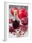 Glass Bottle with Pomegranate Juice and Pomegranates-Jana Ihle-Framed Photographic Print