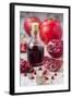 Glass Bottle with Pomegranate Juice and Pomegranates-Jana Ihle-Framed Photographic Print