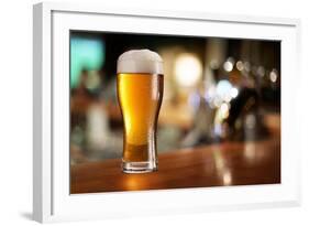 Glass of Light Beer on a Dark Pub.-Volff-Framed Photographic Print