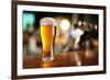 Glass of Light Beer on a Dark Pub.-Volff-Framed Photographic Print