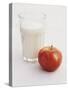 Glass of Milk and Red Apple-Roger Stowell-Stretched Canvas