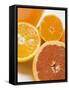 Glass of Orange Juice, Grapefruit and Oranges-null-Framed Stretched Canvas