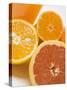 Glass of Orange Juice, Grapefruit and Oranges-null-Stretched Canvas