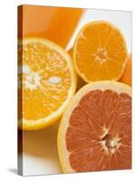 Glass of Orange Juice, Grapefruit and Oranges-null-Stretched Canvas