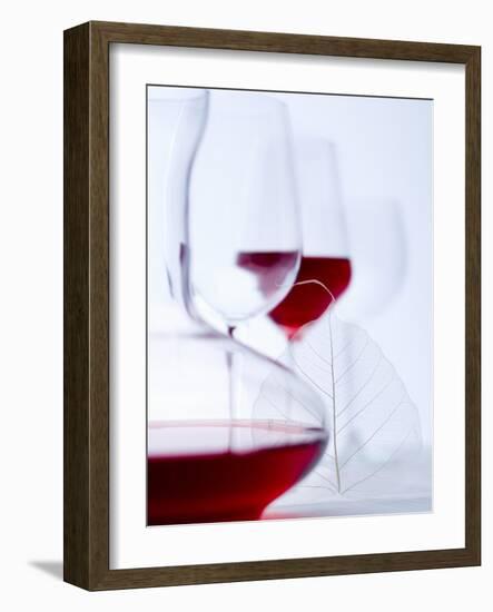 Glass of Red Wine, Carafe and Empty Wine Glasses-null-Framed Photographic Print