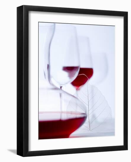 Glass of Red Wine, Carafe and Empty Wine Glasses-null-Framed Photographic Print