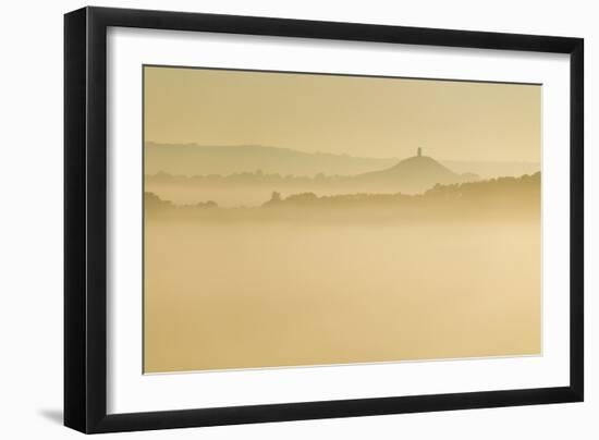 Glastonbury Tor and surrounding hills rising above early morning mist, Glastonbury, Somerset-Stuart Black-Framed Photographic Print