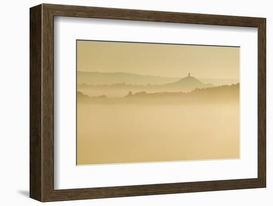 Glastonbury Tor and surrounding hills rising above early morning mist, Glastonbury, Somerset-Stuart Black-Framed Photographic Print