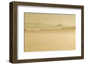 Glastonbury Tor and surrounding hills rising above early morning mist, Glastonbury, Somerset-Stuart Black-Framed Photographic Print