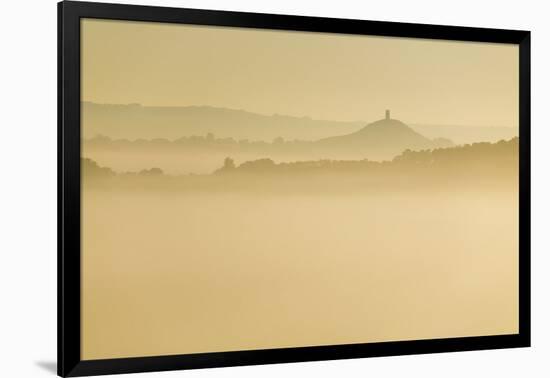 Glastonbury Tor and surrounding hills rising above early morning mist, Glastonbury, Somerset-Stuart Black-Framed Photographic Print