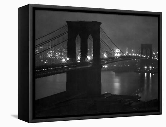 Glittering Night View of the Brooklyn Bridge Spanning the Glassy Waters of the East River-Andreas Feininger-Framed Stretched Canvas