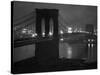 Glittering Night View of the Brooklyn Bridge Spanning the Glassy Waters of the East River-Andreas Feininger-Stretched Canvas