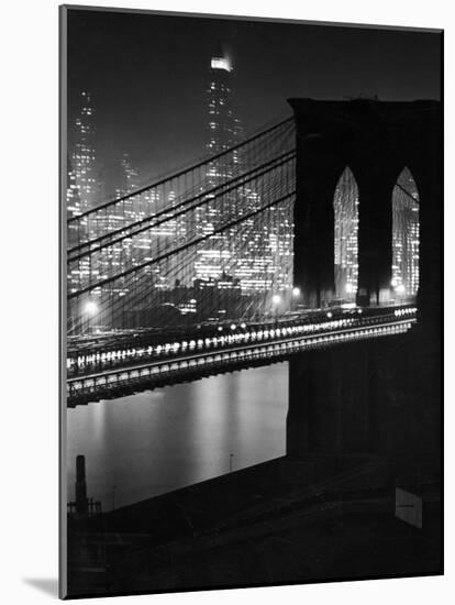 Glittering Night View of the Brooklyn Bridge Spanning the Glassy Waters of the East River-Andreas Feininger-Mounted Photographic Print