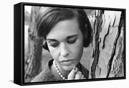 Gloria Vanderbilt Smoking Outside and Showing New Hairdo, 1963-Paul Schutzer-Framed Stretched Canvas