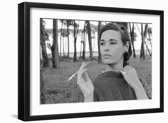 Gloria Vanderbilt Smoking Outside and Showing New Hairdo, 1963-Paul Schutzer-Framed Premium Photographic Print