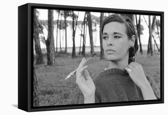 Gloria Vanderbilt Smoking Outside and Showing New Hairdo, 1963-Paul Schutzer-Framed Stretched Canvas