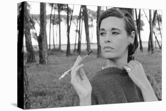 Gloria Vanderbilt Smoking Outside and Showing New Hairdo, 1963-Paul Schutzer-Stretched Canvas