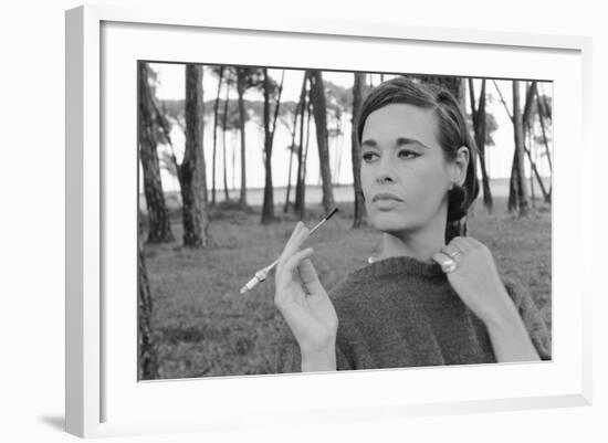 Gloria Vanderbilt Smoking Outside and Showing New Hairdo, 1963-Paul Schutzer-Framed Photographic Print