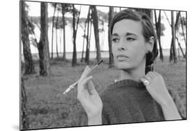 Gloria Vanderbilt Smoking Outside and Showing New Hairdo, 1963-Paul Schutzer-Mounted Photographic Print