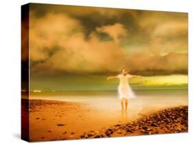 Glowing Woman Standing on the Beach-Jan Lakey-Stretched Canvas