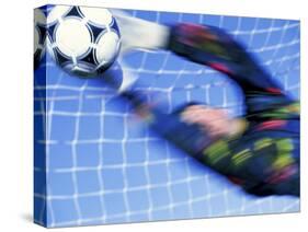Goalie Attempting to Stop a Soccer Ball-null-Stretched Canvas