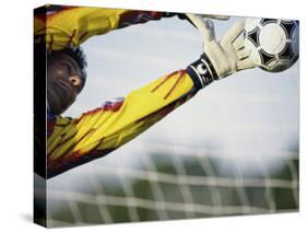 Goalie Attempting to Stop a Soccer Ball-null-Stretched Canvas