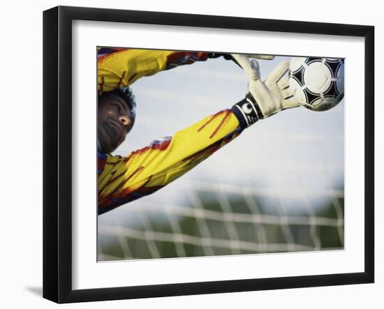 Goalie Attempting to Stop a Soccer Ball-null-Framed Photographic Print