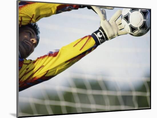 Goalie Attempting to Stop a Soccer Ball-null-Mounted Photographic Print