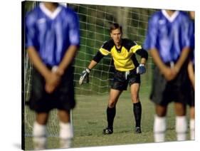 Goalie Preparing to Block Penalty Shot-null-Stretched Canvas