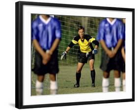 Goalie Preparing to Block Penalty Shot-null-Framed Photographic Print