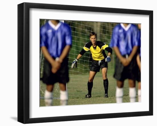 Goalie Preparing to Block Penalty Shot-null-Framed Photographic Print