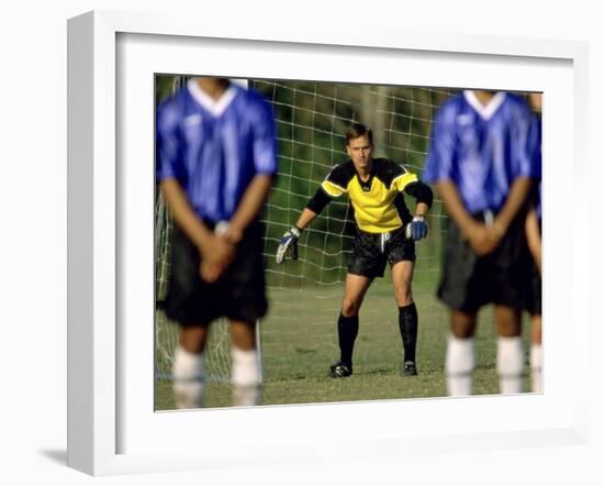 Goalie Preparing to Block Penalty Shot-null-Framed Photographic Print