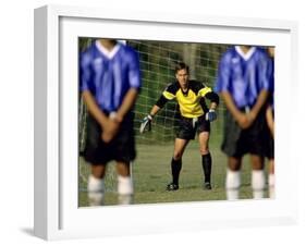 Goalie Preparing to Block Penalty Shot-null-Framed Photographic Print