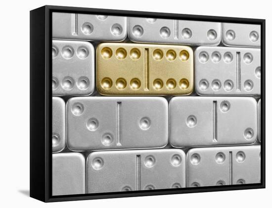 Gold domino amid silver dominoes-null-Framed Stretched Canvas