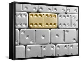 Gold domino amid silver dominoes-null-Framed Stretched Canvas