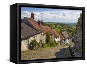 Gold Hill, cobbled lane lined with cottages and views over countryside, Shaftesbury, Dorset-Stuart Black-Framed Stretched Canvas