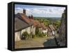 Gold Hill, cobbled lane lined with cottages and views over countryside, Shaftesbury, Dorset-Stuart Black-Framed Stretched Canvas