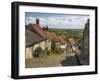 Gold Hill, cobbled lane lined with cottages and views over countryside, Shaftesbury, Dorset-Stuart Black-Framed Premium Photographic Print